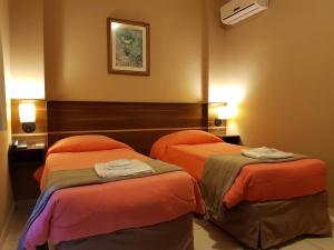 Postel nebo postele na pokoji v ubytování Astro Hotel