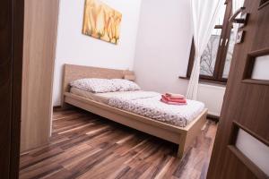 Ένα ή περισσότερα κρεβάτια σε δωμάτιο στο Apartament Premium