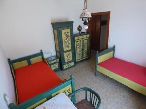 a room with two beds and two dressers at Nestos, Meer und Berge - Griechenland mal anders in Zarkadhiá