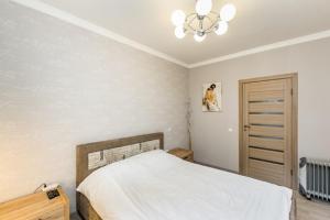 Noemi Jurmala Apartment tesisinde bir odada yatak veya yataklar