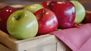 a wooden crate filled with red and green apples at Travelodge by Wyndham San Antonio Downtown Northeast in San Antonio