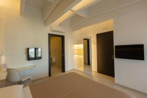 TV a/nebo společenská místnost v ubytování Hotel New Bari