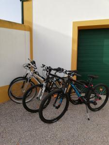 a group of bikes parked next to a garage at Quinta do Feonix in Martinchel