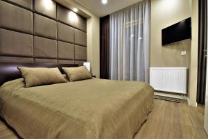 Tempat tidur dalam kamar di Europa Dream Apartment