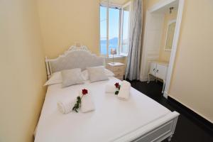 Posteľ alebo postele v izbe v ubytovaní Angiolina Sea View Apartment + 26 fotografií