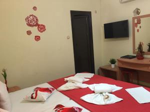 Postel nebo postele na pokoji v ubytování Hotel Karagianni