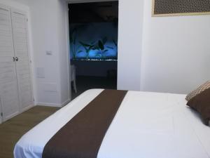 Postel nebo postele na pokoji v ubytování B&B Suites Via del Mare
