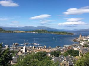 a view of a town with boats in the water at Coel Ila in Benderloch