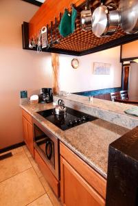 a kitchen with a stove and a counter top at The Ridge Sierra in Stateline
