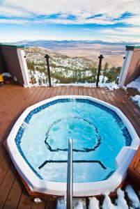 a hot tub on a deck with a view at The Ridge Sierra in Stateline