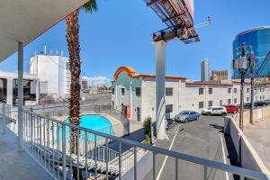 a balcony with a view of a parking lot and a pool at Siegel Select LV Strip-Convention Center in Las Vegas