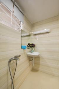 a bathroom with a sink and a mirror at golden time hostel in Hanoi