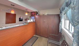 a waiting room with a waiting counter and a window at Budget Inn in Port Hope