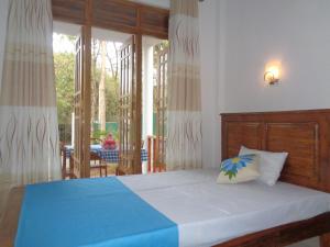 Llit o llits en una habitació de Jungle View Guest