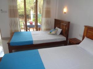 Llit o llits en una habitació de Jungle View Guest