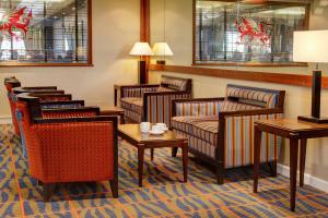 a waiting room with several chairs and tables at Best Western Aberavon Beach Hotel in Port Talbot