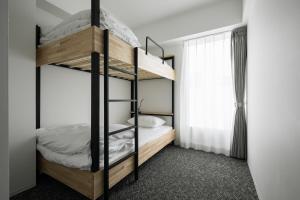Katil atau katil-katil dalam bilik di Imu Hotel Kyoto