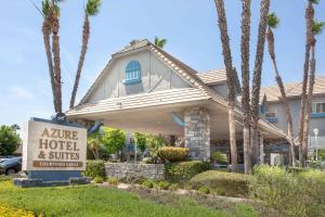 a home for sale with a sign in front of it at Azure Hotel&Suites Ontario Trademark Collection by Wyndham in Ontario