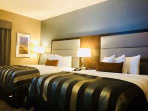 En eller flere senger på et rom på Wingate by Wyndham Kamloops