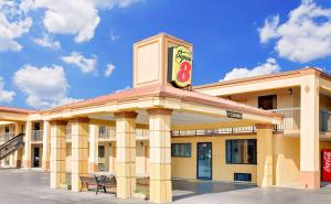 a gas station with a bench in front of it at Super 8 by Wyndham Athens in Athens