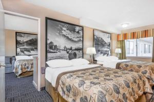 Voodi või voodid majutusasutuse Super 8 by Wyndham Stettler toas