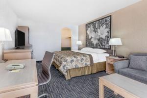 Voodi või voodid majutusasutuse Super 8 by Wyndham Stettler toas