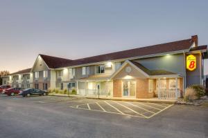 a hotel with a car parked in a parking lot at Super 8 by Wyndham Jackson MN in Jackson