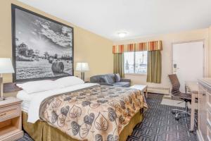Voodi või voodid majutusasutuse Super 8 by Wyndham Stettler toas