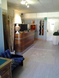 a living room with a couch and a desk at Hotel Touring in Rome