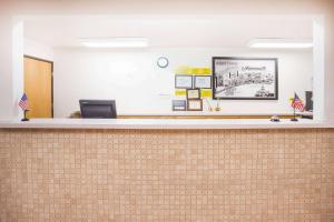 an office with a reception desk and a counter top at Super 8 by Wyndham Monmouth IL in Monmouth
