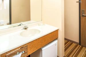 a bathroom with a white sink and a mirror at Super 8 by Wyndham Blair in Blair