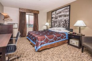 Un ou plusieurs lits dans un hébergement de l'établissement Super 8 by Wyndham Boise