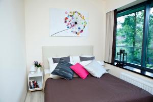 Posteľ alebo postele v izbe v ubytovaní VIP Apartamenty Szklane Domy The View