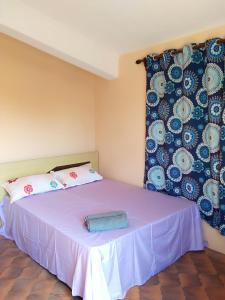 Ένα ή περισσότερα κρεβάτια σε δωμάτιο στο Kaz Ami cozy home