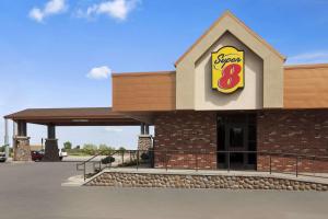 a fast food restaurant with a star sign on it at Super 8 by Wyndham Conrad in Conrad