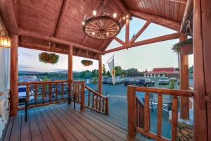 a wooden deck with a view of a marina at Super 8 by Wyndham Cody in Cody