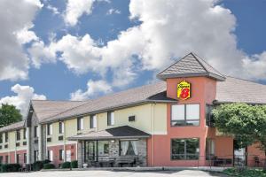 a building with a coca cola sign on it at Super 8 by Wyndham Toledo in Toledo