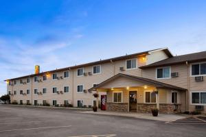 a hotel with a parking lot in front of it at Super 8 by Wyndham Council Bluffs IA Omaha NE Area in Council Bluffs