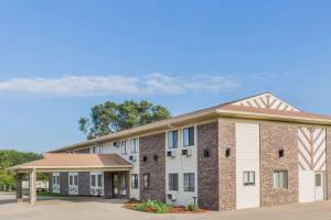 a rendering of the front of a building at Super 8 by Wyndham Madison in Madison