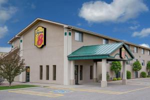a fast food building with a sign on it at Super 8 by Wyndham Willmar in Willmar