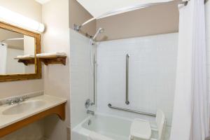 a bathroom with a sink and a toilet and a shower at Super 8 by Wyndham Blue Earth in Blue Earth