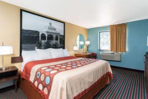 a hotel room with a large bed in a room at Super 8 by Wyndham Bath Hammondsport Area in Bath