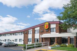 a fast food building with a sign on it at Super 8 by Wyndham Brooklyn Center/MPLS in Brooklyn Center