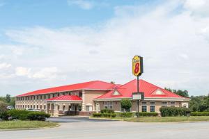 a large building with a red roof at Super 8 by Wyndham Elizabethtown in Elizabethtown