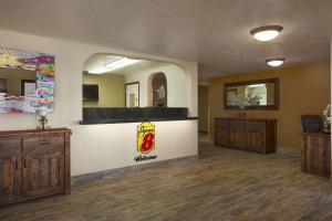 a waiting room with a counter in a room at Super 8 by Wyndham Idaho Falls in Idaho Falls