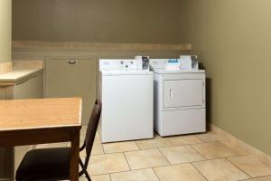 A kitchen or kitchenette at Super 8 by Wyndham Radcliff Ft. Knox Area