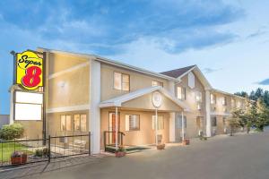 a hotel with a sign in front of it at Super 8 by Wyndham Riverton in Riverton