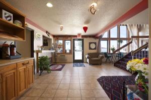 a large living room with a staircase and a living room at Super 8 by Wyndham Las Vegas in Las Vegas