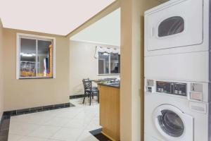 a laundry room with a washer and dryer at Super 8 by Wyndham Nephi in Nephi