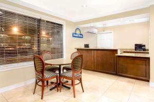 a kitchen and dining room with a table and chairs at Days Inn by Wyndham Kingman East in Kingman